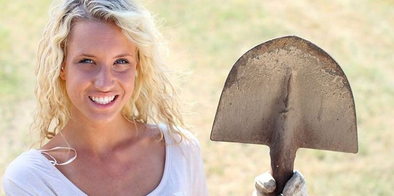 woman holding a shovel