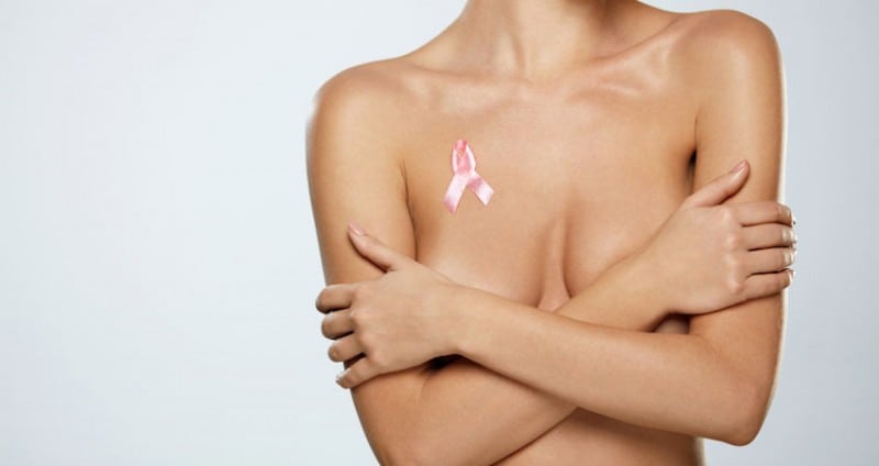 Woman with pink ribbon on chest