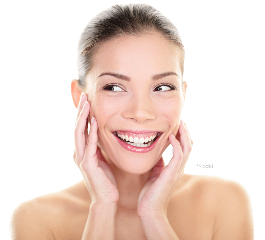 Smiling woman touching her face