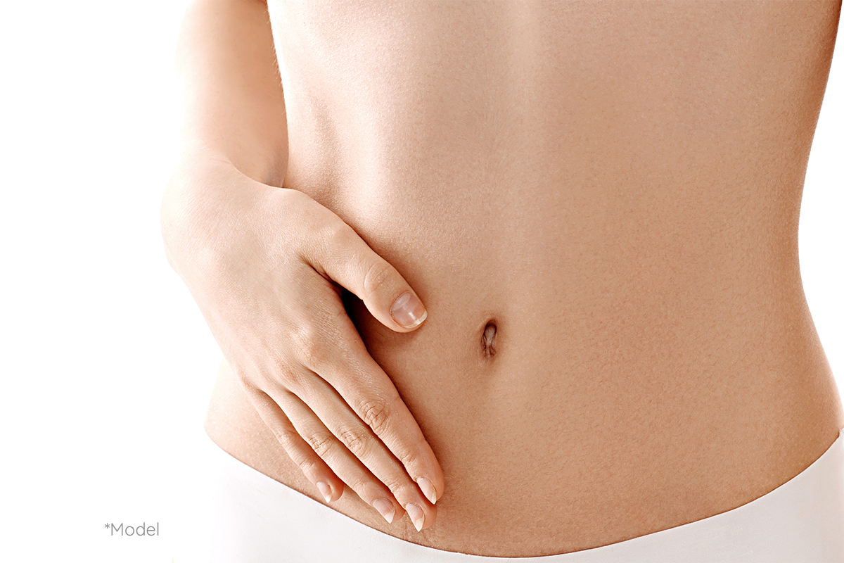 woman touching stomach