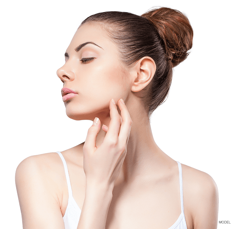 Woman looking sideways touching jaw