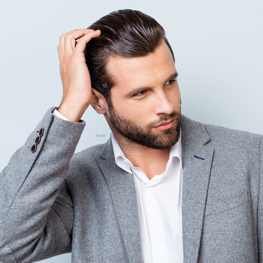 Man running hands through hair